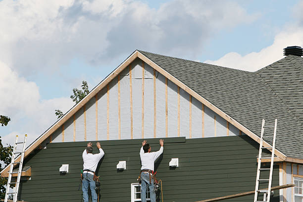 Professional Storm Damage Siding Repair technician working in Fort Hill, PA